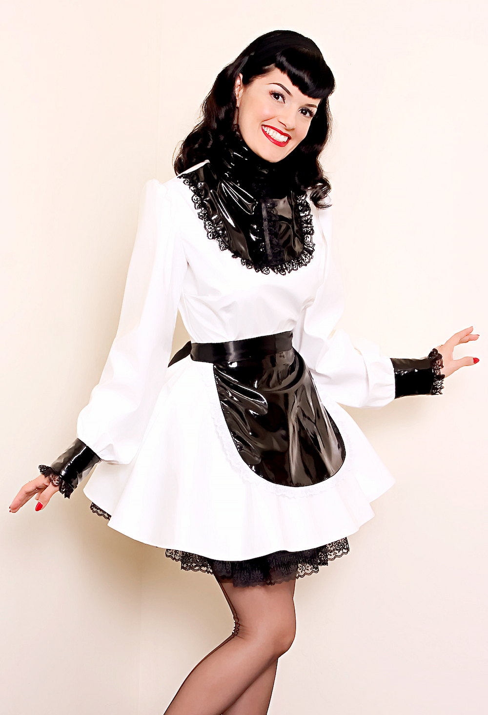 Bernie Dexter in original Versatile Fashions Victorian Maid Dress in white PVC w/ black PVC apron & black lace trim