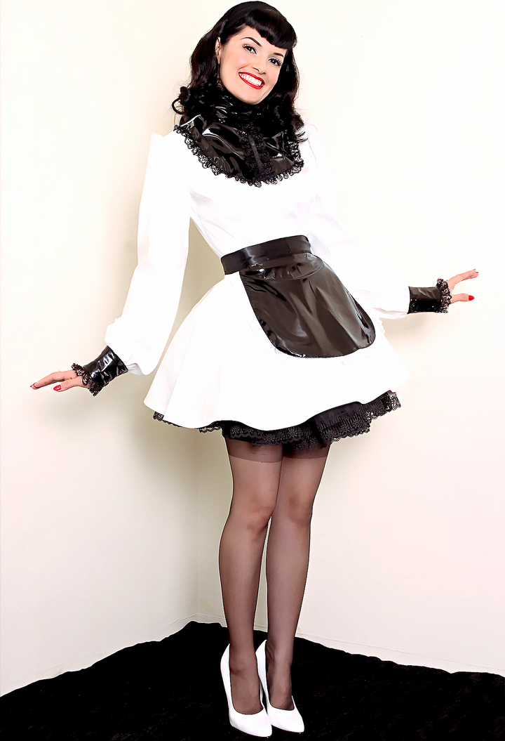 Bernie Dexter in original Versatile Fashions Victorian Maid Dress in white PVC w/ black PVC apron & black lace trim